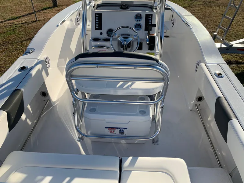 Slide: The Image of 2024 Robalo R202 Explorer boat interior with helm and seating. - 6