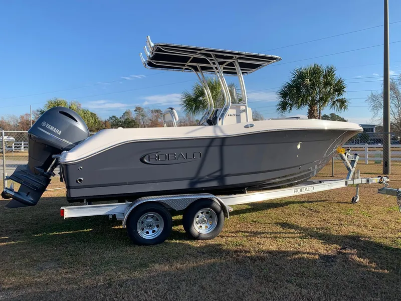 The Image of 2024 Robalo R202 Explorer boat on trailer with Yamaha outboard motor. - 0