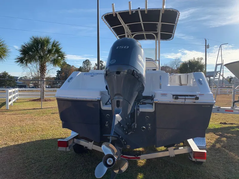 Slide: The Image of 2024 Robalo R202 Explorer boat with Yamaha 150 engine, rear view on trailer. - 2