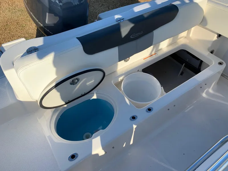 Slide: The Image of 2024 Robalo R202 Explorer boat interior with livewell and storage compartments. - 7