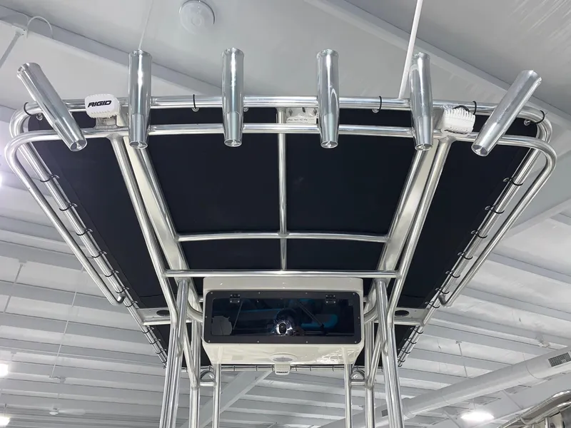 Slide: The Image of 2024 Key West 219 FS boat T-top with rod holders and electronics. - 11