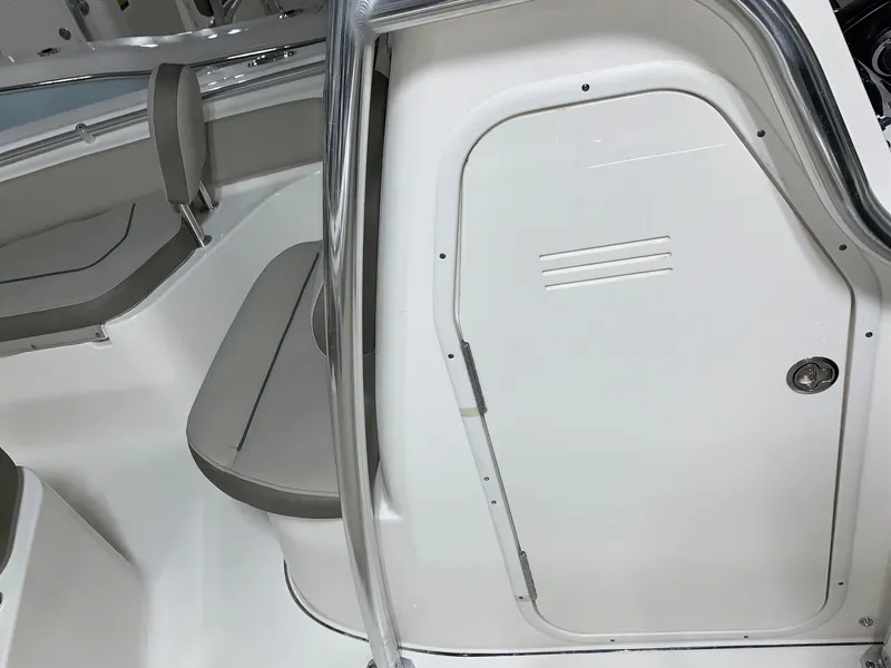 Slide: The Image of 2024 Key West 219 FS boat interior with seating and storage compartment. - 15