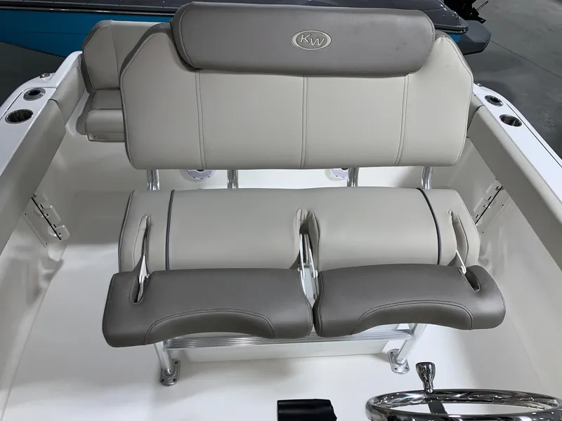 Slide: The Image of 2024 Key West 219 FS boat seating with gray and white upholstery. - 17