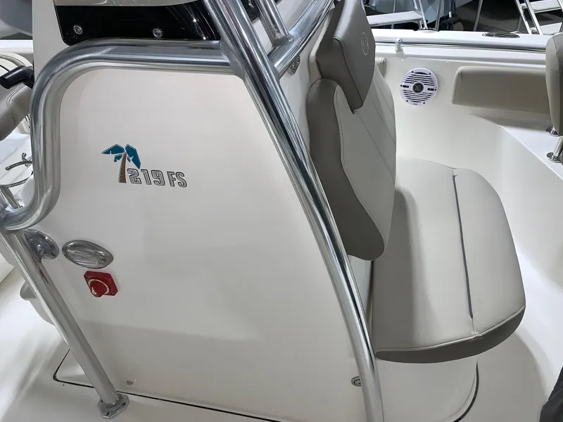 Slide: The Image of 2024 Key West 219 FS boat interior with seating and console. - 19