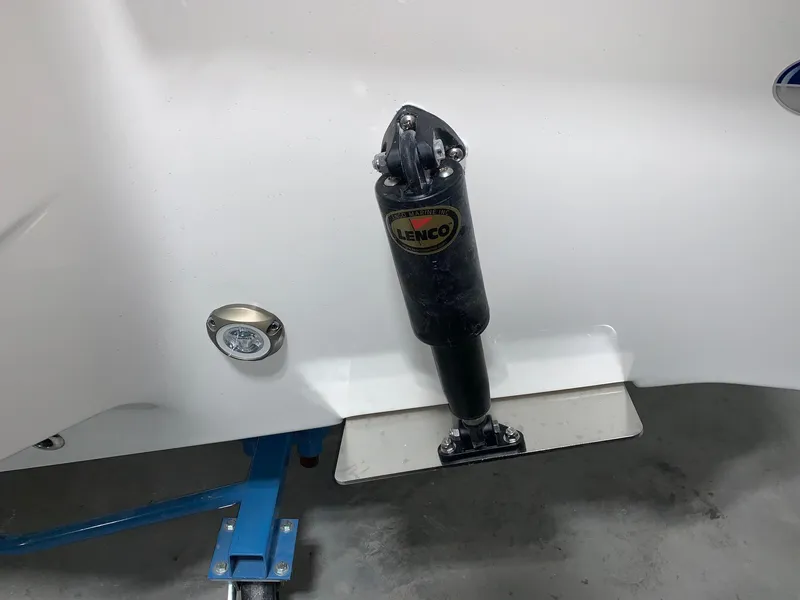 Slide: The Image of 2024 Key West 219 FS boat with Lenco trim tab actuator. - 4
