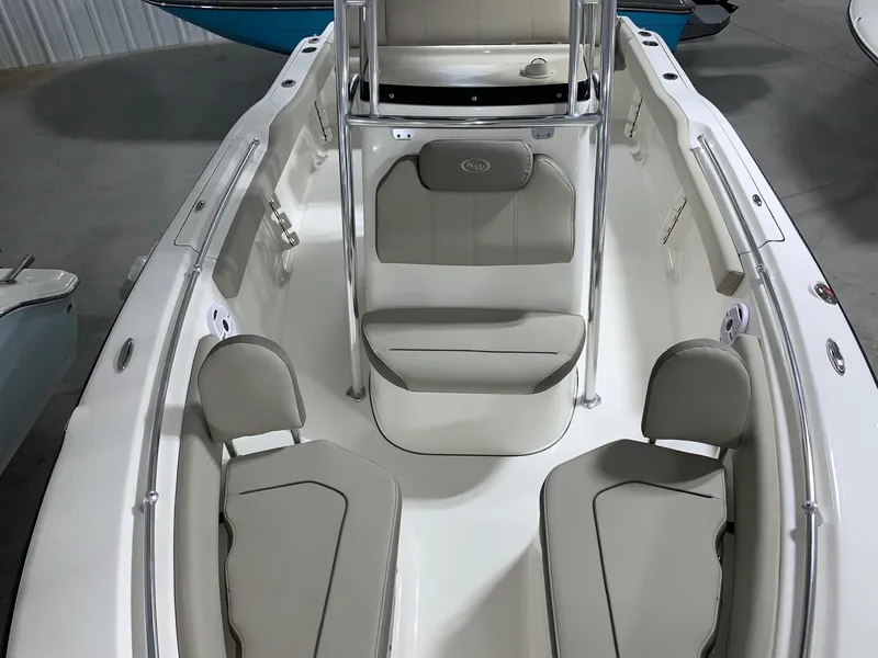 Slide: The Image of 2024 Key West 219 FS boat interior with cushioned seating and modern design. - 5