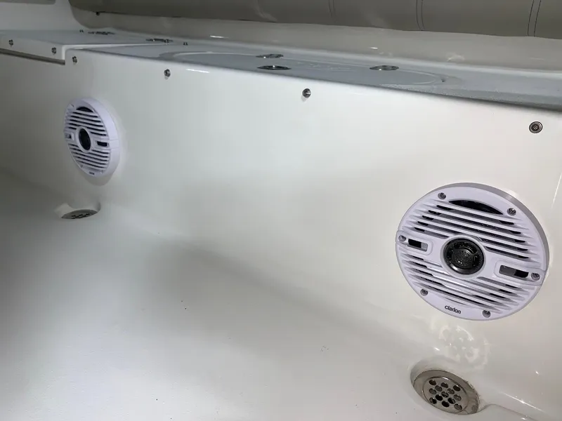 Slide: The Image of 2024 Key West 219 FS boat interior with built-in speakers. - 7