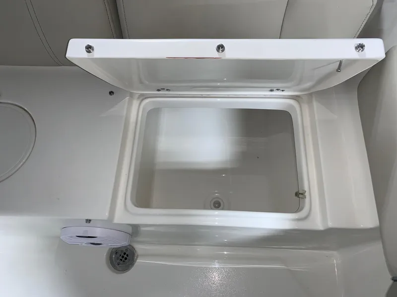 Slide: The Image of Open storage compartment on a 2024 Key West 219 FS boat. - 8