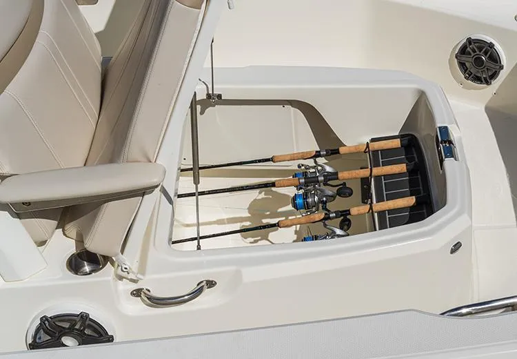 Slide: The Image of 2023 Boston Whaler 220 Dauntless boat with fishing rod storage compartment. - 5