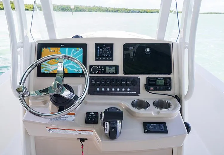 Slide: The Image of 2023 Boston Whaler 250 Dauntless boat dashboard with navigation and control systems. - 5
