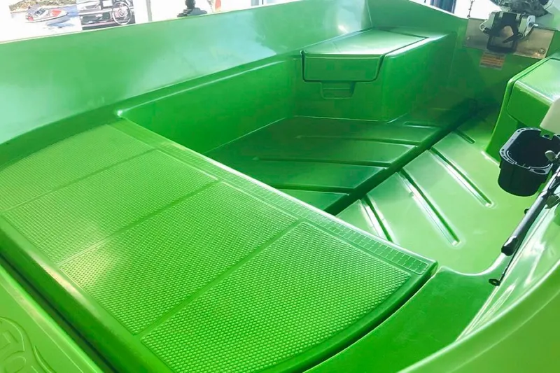 Slide: The Image of Bright green interior of a 2021 Polycraft 300 Tuffy boat. - 5