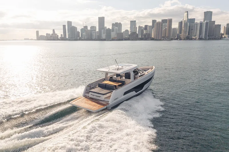 Slide: The Image of 2024 Fjord 41 XL yacht cruising near city skyline on sunny day. - 19