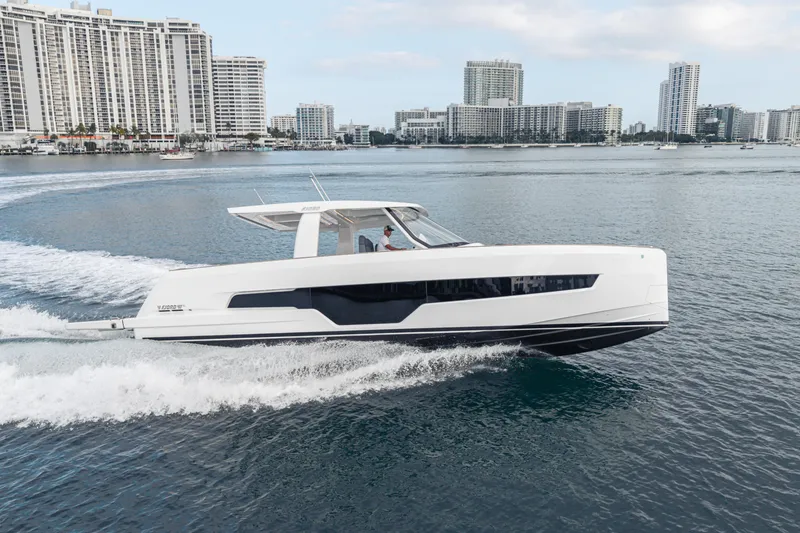 Slide: The Image of 2024 Fjord 41 XL yacht cruising near city skyline on calm water. - 21