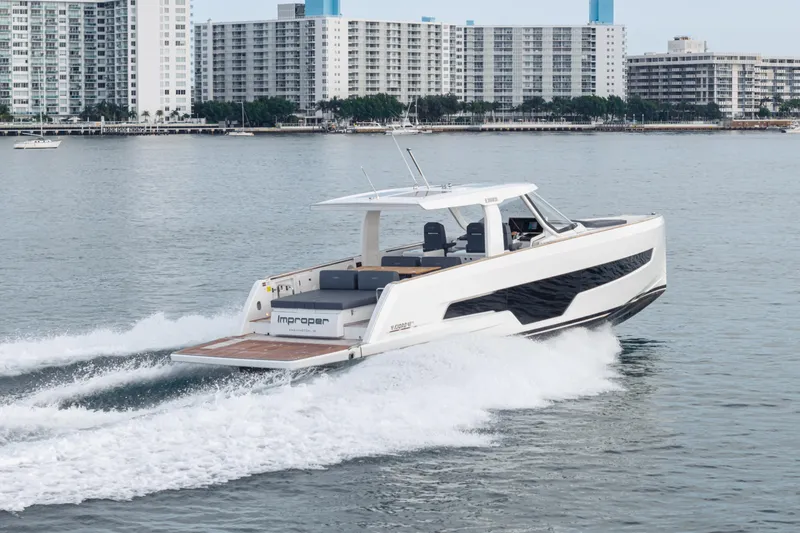 Slide: The Image of 2024 Fjord 41 XL yacht cruising near city skyline, showcasing sleek design and performance. - 22