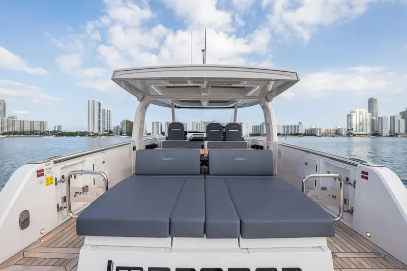 Slide: The Image of 2024 Fjord 41 XL luxury yacht with spacious deck, city skyline in background. - 29