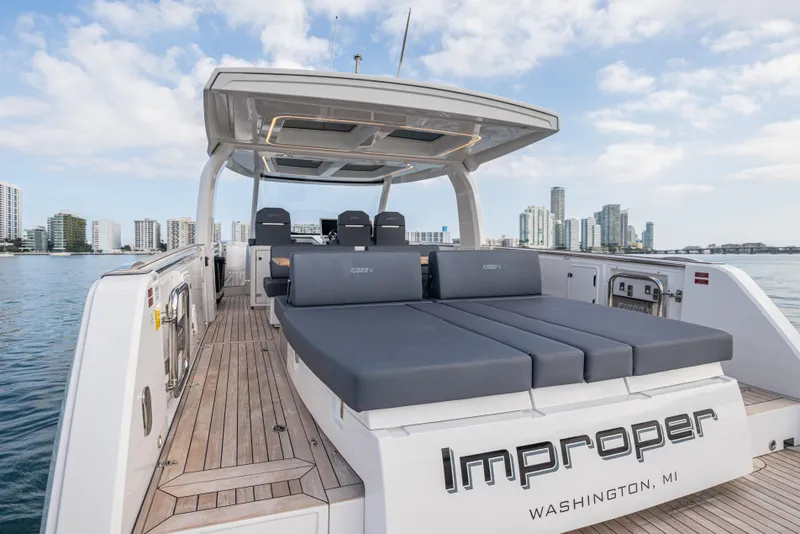 Slide: The Image of 2024 Fjord 41 XL luxury yacht with spacious deck, city skyline in background. - 30