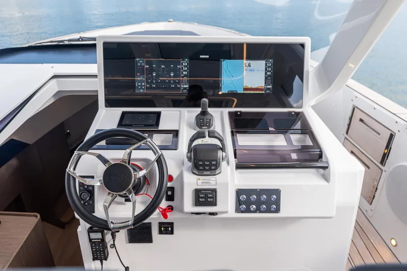 Slide: The Image of Helm of 2024 Fjord 41 XL yacht with advanced navigation controls and displays. - 36
