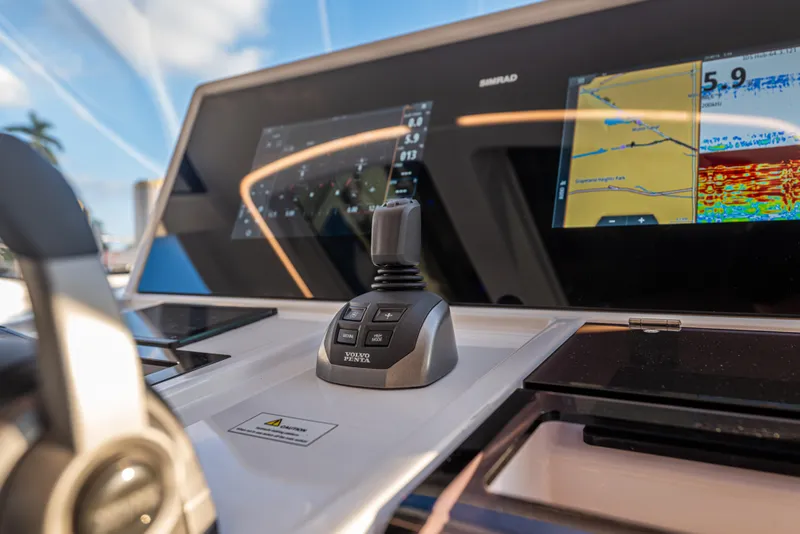 Slide: The Image of 2024 Fjord 41 XL yacht dashboard with navigation controls and display screens. - 37