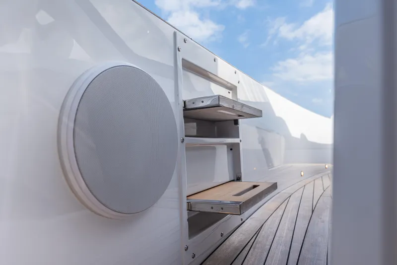 Slide: The Image of 2024 Fjord 41 XL yacht deck with speaker and foldable steps. - 39