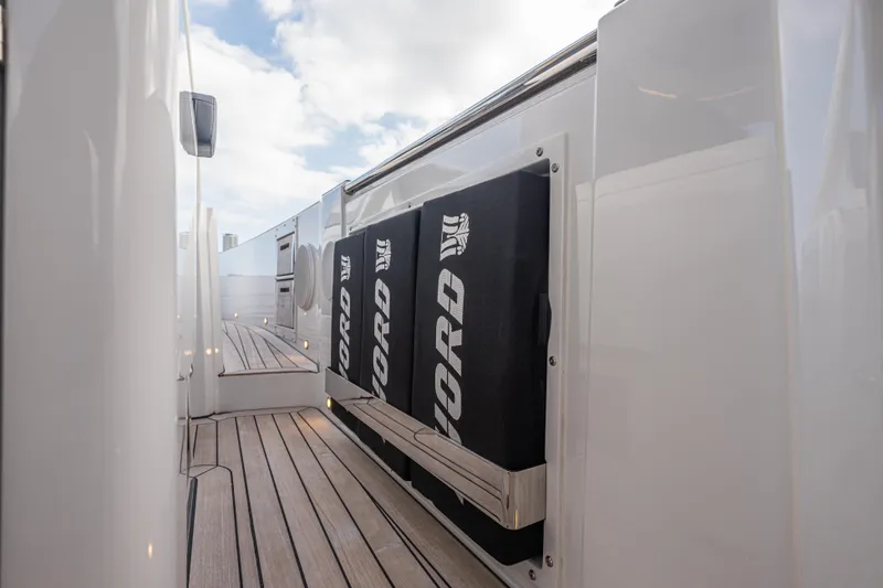 Slide: The Image of 2024 Fjord 41 XL yacht deck with sleek design and branded storage compartments. - 40