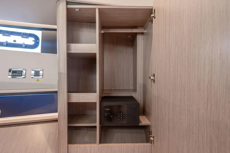 Slide: The Image of 2024 Fjord 41 XL interior cabinet with safe and shelving. - 45