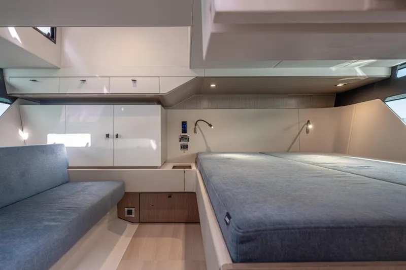 Slide: The Image of 2024 Fjord 41 XL yacht interior with modern bed and seating area. - 47