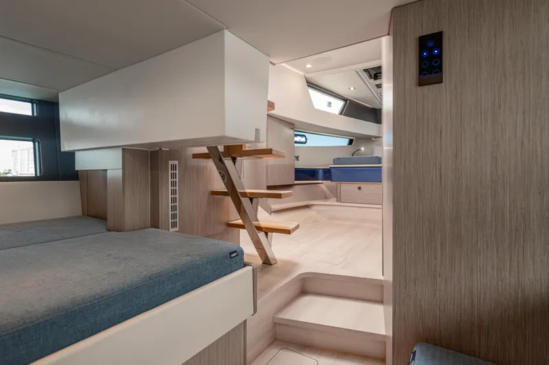 Slide: The Image of 2024 Fjord 41 XL yacht interior with modern design and wooden stairs. - 50
