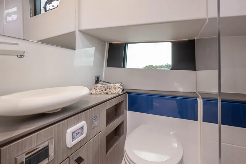 Slide: The Image of Luxurious bathroom interior of 2024 Fjord 41 XL yacht with modern fixtures and window view. - 52