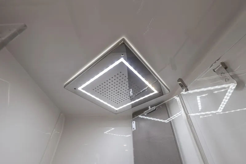 Slide: The Image of Modern showerhead with LED lighting in 2024 Fjord 41 XL yacht bathroom. - 54