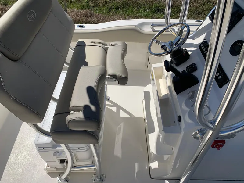 Slide: The Image of 2024 Key West 219 FS boat interior with helm and seating. - 11