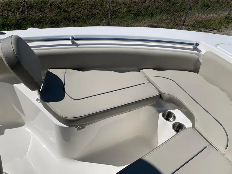 Slide: The Image of 2024 Key West 219 FS boat with cushioned seating and cup holders. - 15