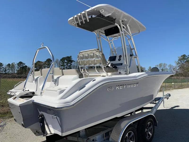 Slide: The Image of 2024 Key West 219 FS boat on a trailer, side view. - 2