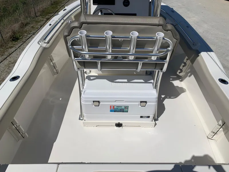 Slide: The Image of 2024 Key West 219 FS boat interior with rod holders and cooler. - 3