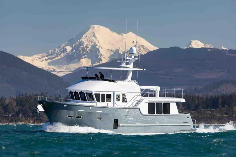 The Image of 2025 Northern Marine 57 Expedition yacht cruising with snowy mountain backdrop. - 0