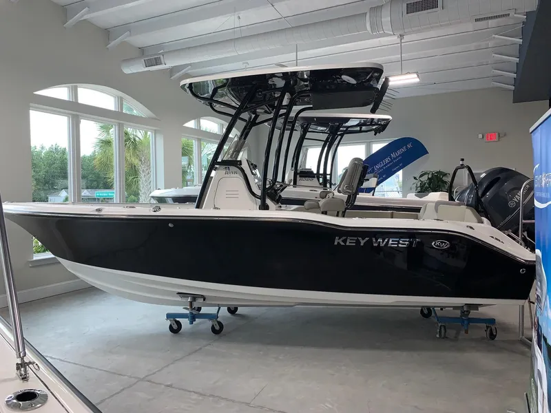 Slide: The Image of 2024 Key West 219 FS boat displayed indoors. - 0