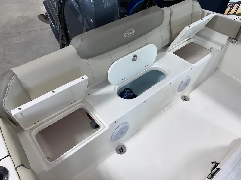 Slide: The Image of 2024 Key West 219 FS boat interior with storage compartments and seating. - 6