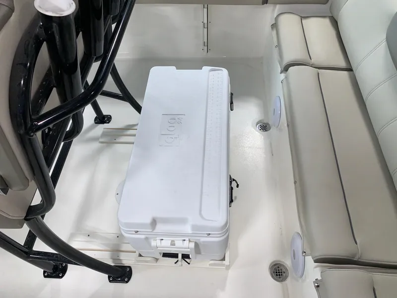 Slide: The Image of 2024 Key West 219 FS boat interior with cooler and seating. - 8