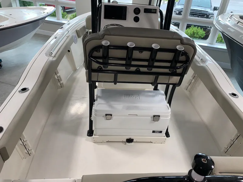 Slide: The Image of 2024 Key West 219 FS boat interior with seating and cooler. - 5