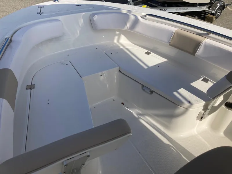 Slide: The Image of 2024 Robalo R200 Center Console boat interior with spacious seating and storage compartments. - 9