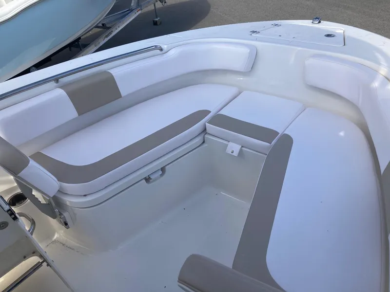 Slide: The Image of 2024 Robalo R200 Center Console boat with spacious seating area. - 13