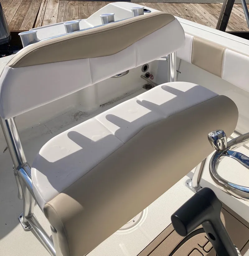 Slide: The Image of 2024 Robalo R200 Center Console boat seating and console area. - 6