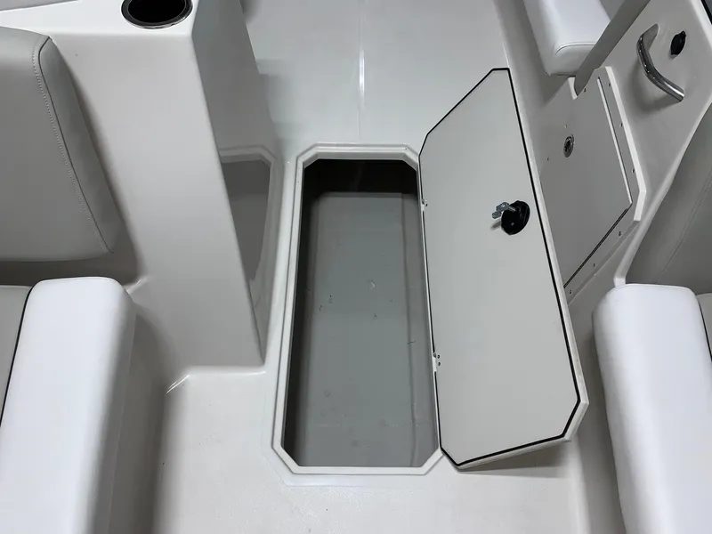 Slide: The Image of 2024 Starcraft SVX 191 boat interior storage compartment with open hatch. - 10