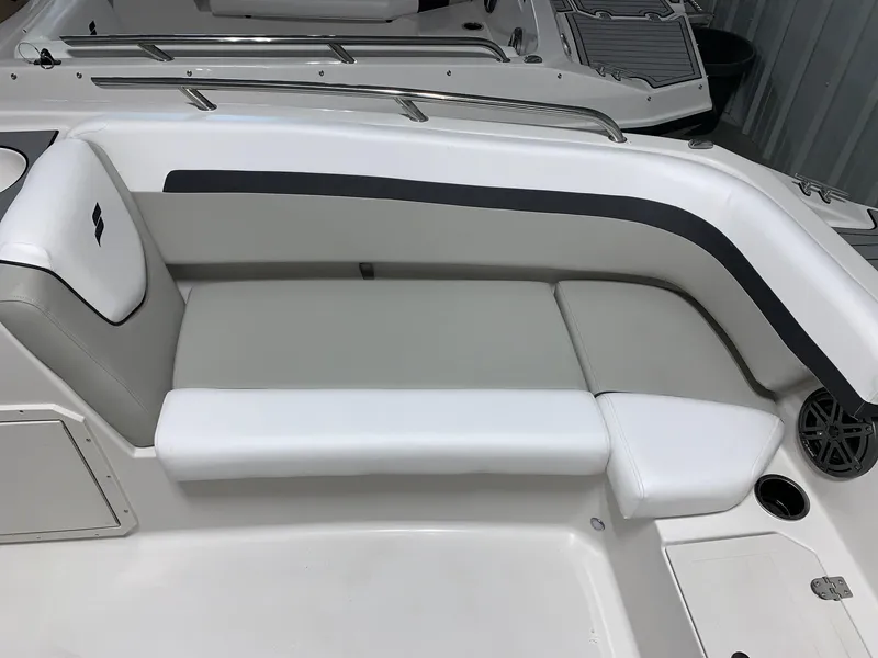 Slide: The Image of 2024 Starcraft SVX 191 boat interior seating with white and gray upholstery. - 13
