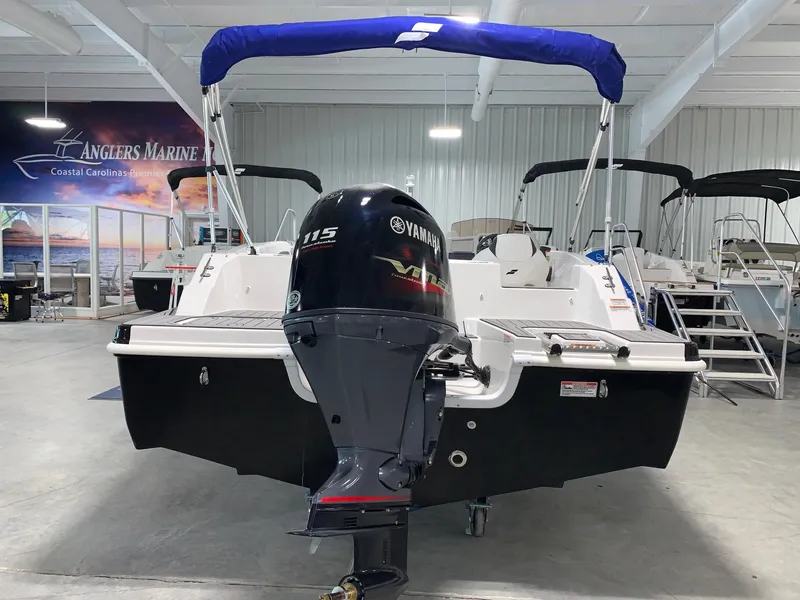 Slide: The Image of 2024 Starcraft SVX 191 boat with Yamaha 115 engine in showroom. - 2