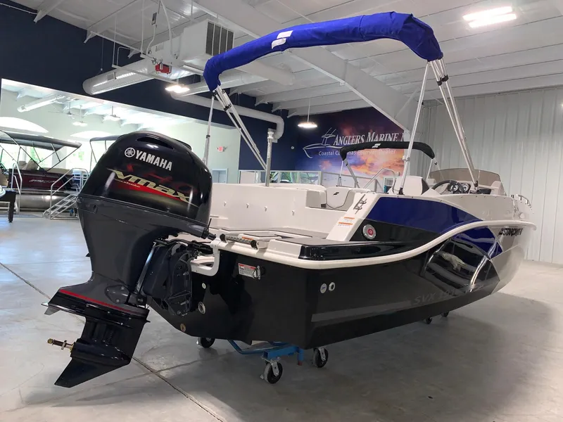 Slide: The Image of 2024 Starcraft SVX 191 boat with Yamaha outboard motor in showroom. - 3