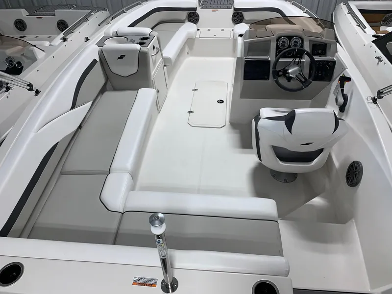Slide: The Image of 2024 Starcraft SVX 191 boat interior with white seating and modern dashboard. - 5