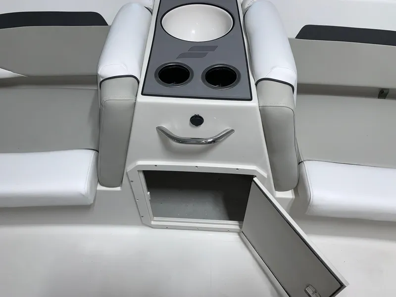 Slide: The Image of 2024 Starcraft SVX 191 boat interior with storage compartment and cup holders. - 9
