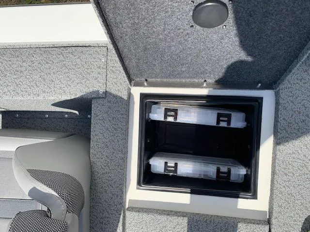 Slide: The Image of 2021 G3 Sportsman 1710 PFX storage compartment with tackle boxes. - 10