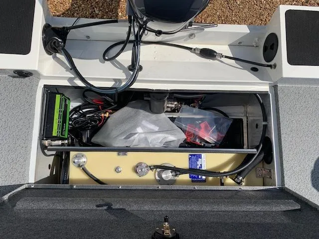 Slide: The Image of 2021 G3 Sportsman 1710 PFX boat storage compartment with wiring and equipment. - 11
