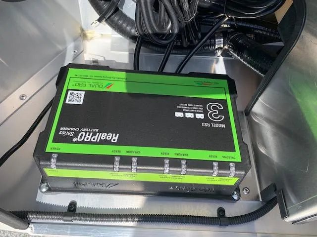 Slide: The Image of Battery charger in a 2021 G3 Sportsman 1710 PFX boat. - 12